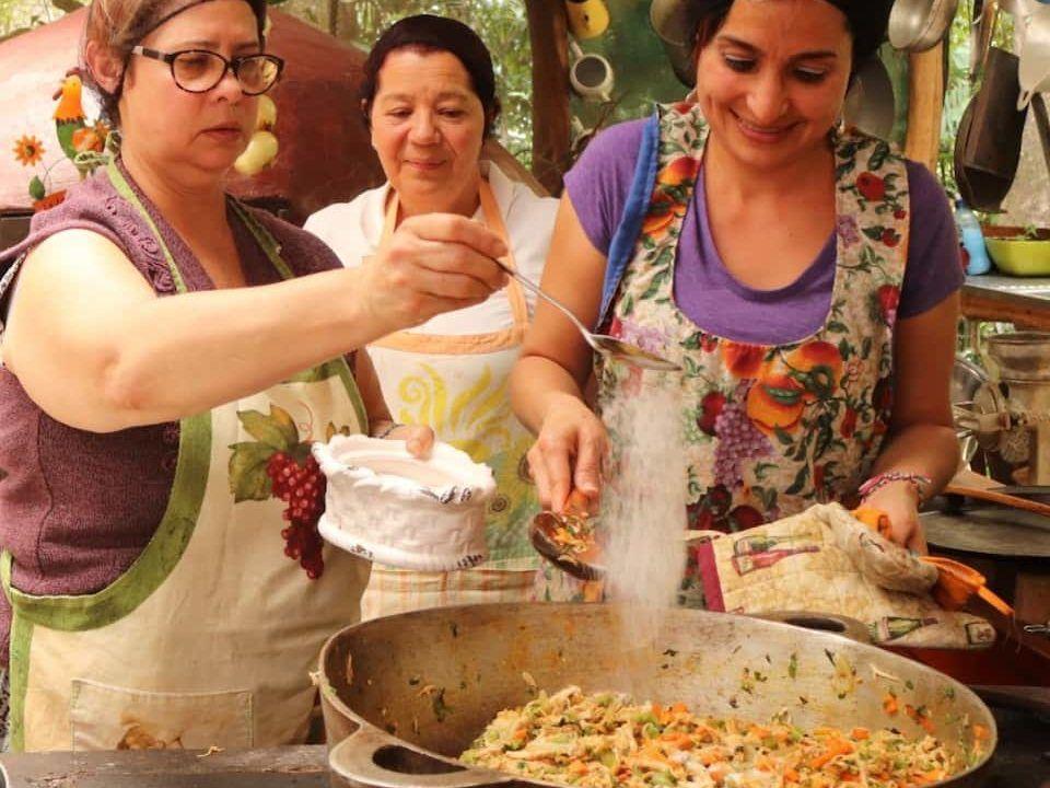 Local hosts sharing a Costa Rican cooking experience